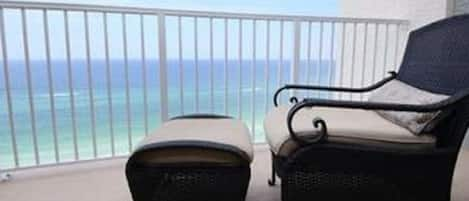 Relax and enjoy your favorite beverage on the large beach front balcony