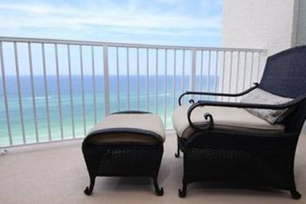 Relax and enjoy your favorite beverage on the large beach front balcony