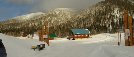 Bighorn Estates entrance off Hwy 20. Winter wonderland, Summer peace. Mile 203