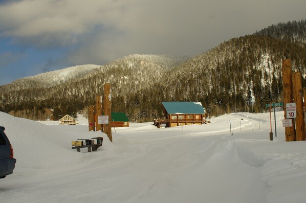 Bighorn Estates entrance off Hwy 20. Winter wonderland, Summer peace. Mile 203