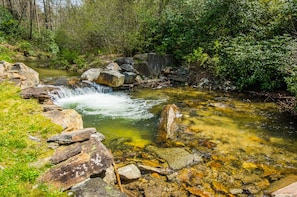 Pool and small waterfall feet from cabin.