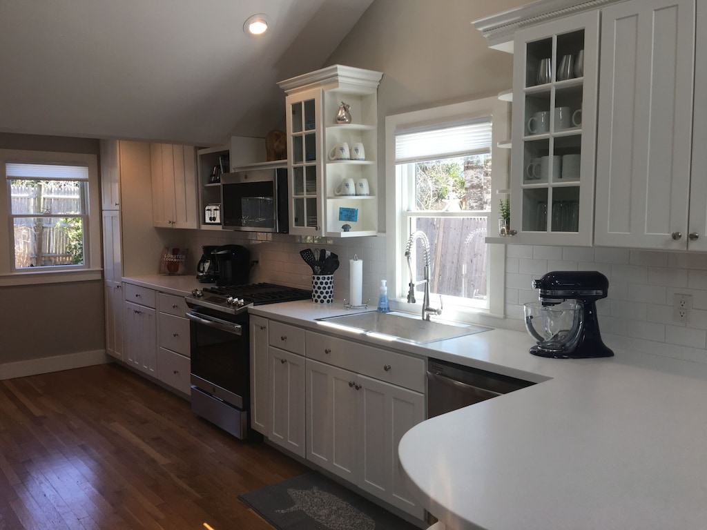 A large kitchen with newer appliances in a Cape Cod vacation rental 