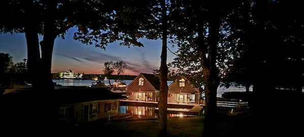 Harbor House and Lighthouse at night
