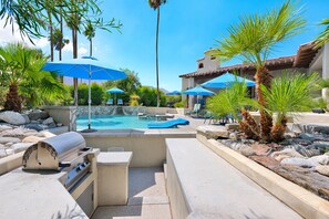 Sunken Kitchen By Pool.  Four Submerged Bar Stools on Pool Side