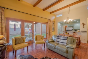 Large doors expand the indoor living space into the outdoor patio setting