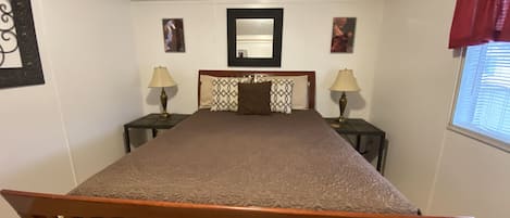 Queen bed in the master bedroom.