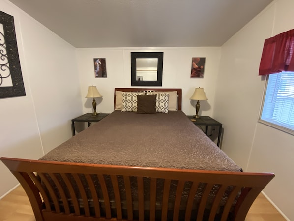 Queen bed in the master bedroom.