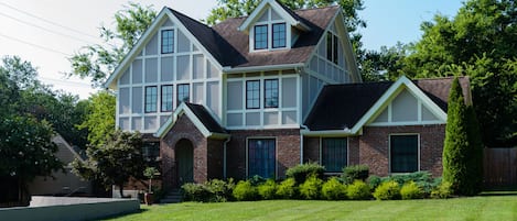 Spacious and level front yard. The street has a sidewalk and bike path.