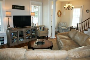 Enjoy the river right from the brand new leather sectional. Smart TV also!