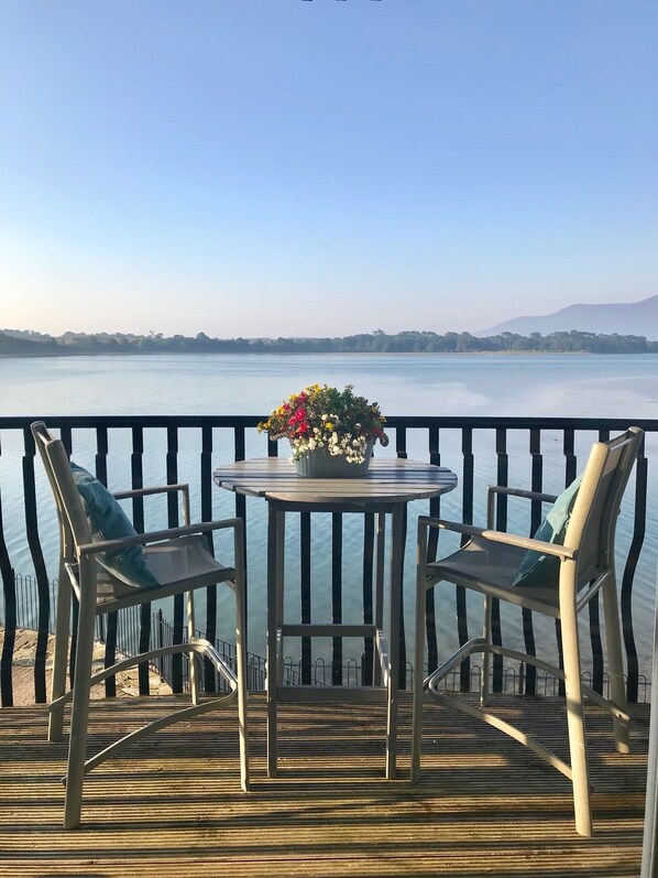 Relax on the balcony to take in the sweeping views of the bay and mountains