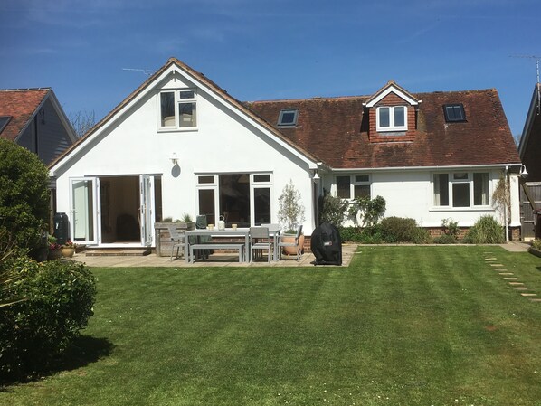Our beautiful south facing garden, patio dining set  and BBQ. 
