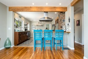 Large downstairs chef's kitchen with eat up bar