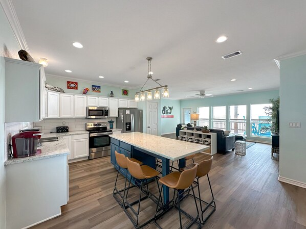 Cook up a storm in the modern kitchen with stainless steel appliances, perfect for creating meals or quick snacks during your stay.