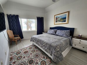 Master bedroom with king size bed huge windows with direct ocean views.