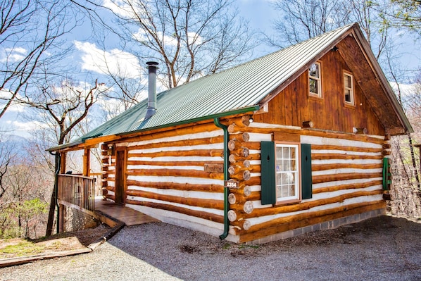 Real Pine log and chinked cabin at the top of the mountain with paved roads up