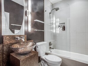 Second bathroom with a bath and shower