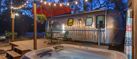 Our hot tub under the twinkle lights is super romantic.