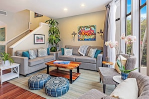 Thoughtfully furnished with a blend of island charm and modern comfort, this inviting space is perfect for relaxing after a day of exploring.