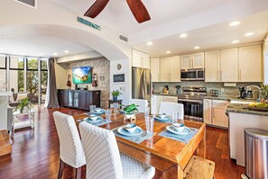 Experience effortless island living in this bright, clean, and modern open floor plan that seamlessly connects the living room to the kitchen.