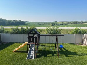 Kid’s play set in fully fenced backyard