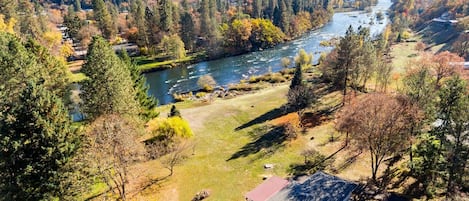 Aerial showing home, yard and river frontage!