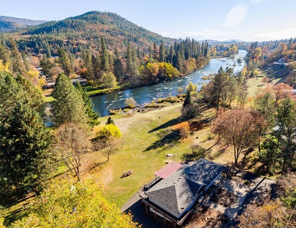 Aerial showing home, yard and river frontage!
