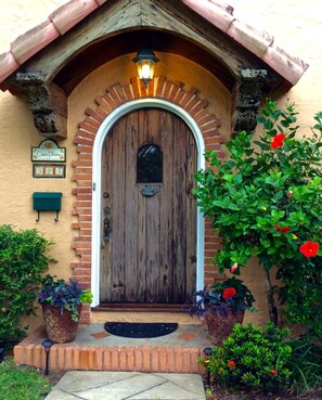Front door is Pecky Cypress and is original to the 1925 historic home