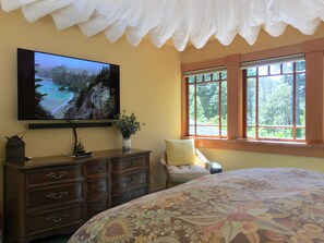 Upstairs Bedroom has a chair, bureau, and 55" OLED TV, with Netflix, Hulu, etc.