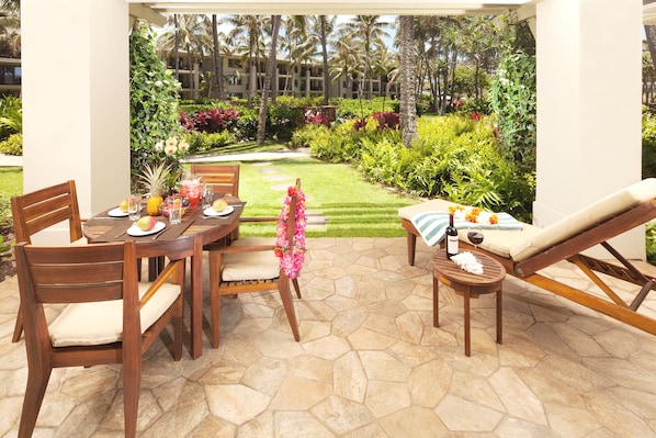Pool and garden view lanai - with dining table, chaise lounge and end table!