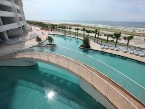 Fun in the sun at the main outdoor pool with adjacent Tiki Bar serving treats!