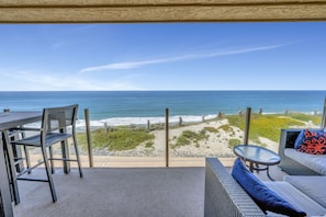 View from Living room -large couch on porch