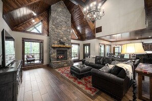 Great Room with 26 foot ceilings - Note: FIREPLACE INOPERABLE in summer.