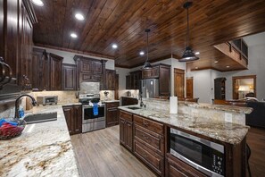 Beautiful kitchen with granite counters and modern, stainless steel appliances