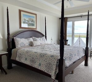 Master bedroom: Tommy Bahama four poster bed and matching armoire plus bay views