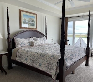 Master bedroom: Tommy Bahama four poster bed and matching armoire plus bay views