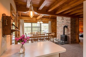 Dining room, with view out to lake Pauline. (Note: wood stove not for use)