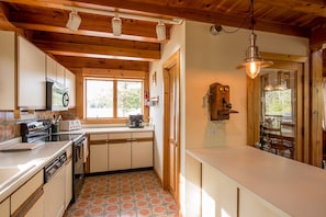 Kitchen with view out to Lake Rescue. 