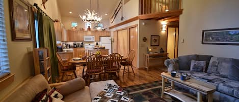 View of main living area. Dining area blends seamlessly with game and TV area.