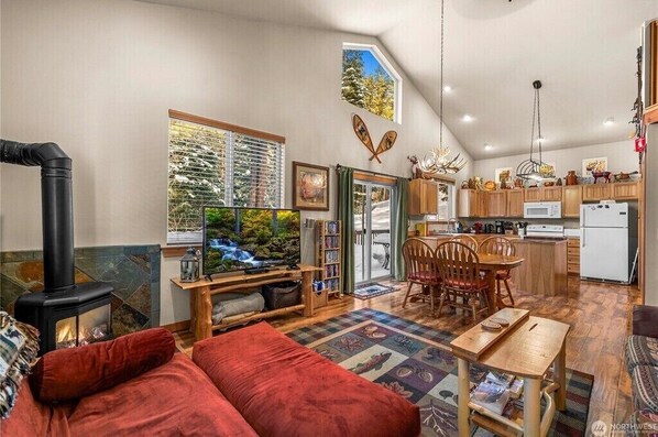 View of main living area. Dining area blends seamlessly with game and TV area.