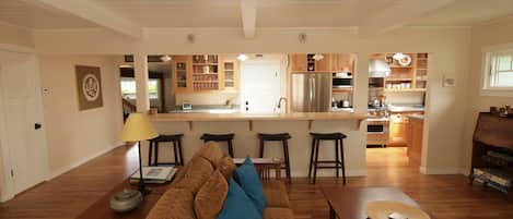 Walk into the great room with bar overlooking the kitchen.