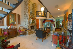 Living room with 2 story stone fireplace