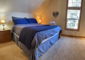 Kings size bed in the upstairs master suite 