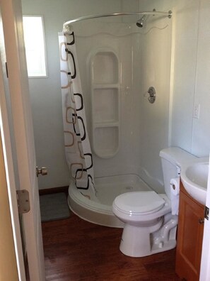 Bathroom with full corner shower