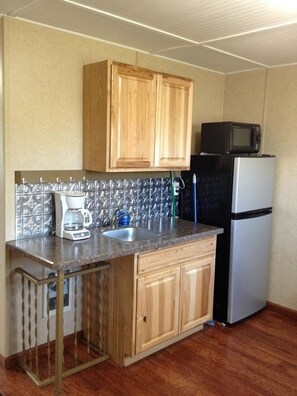 Micorwave, coffee maker, toaster and fridge.