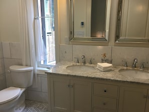 Heated marble floor. Double sinks and extensive storage in 1st bathroom.