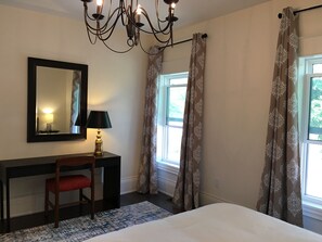 This master bedroom view features the writing desk lighting.