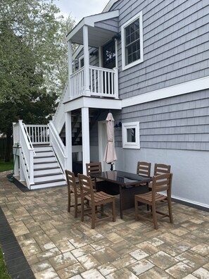 Private dining area with BBQ, table, out door shower and access to laundry room