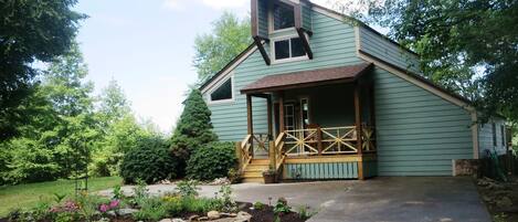 The gardens and rocking chair front porch of Mountain Vista Retreat.