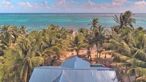 Incredible aerial view of the sea and Escape Away Beach House property
 