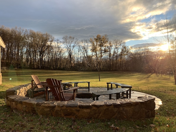 enjoy a beautiful firepit under the stars near the house.